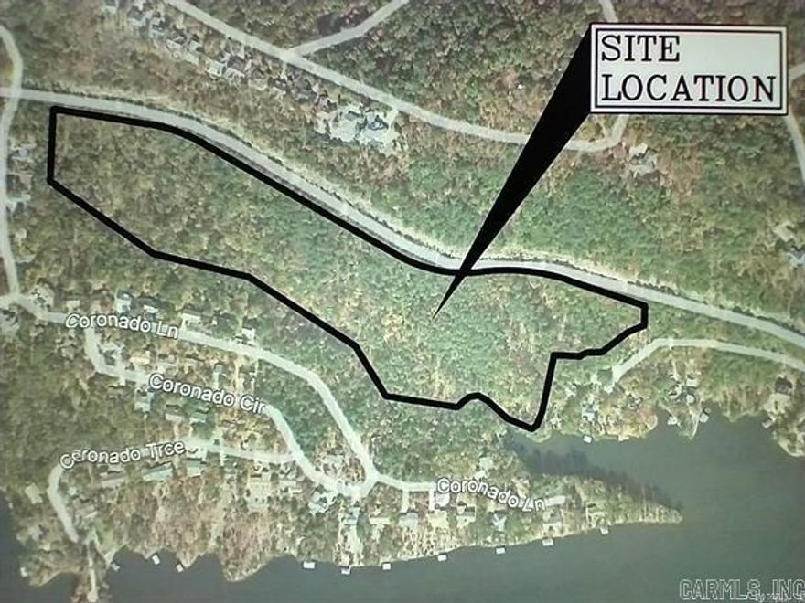 Rare opportunity to own 21.9 sub dividable acres with 418 feet of lake frontage in Hot Springs Village. This exceptional tract offers many thousands of dollars in timber value, allowing for selective thinning to enhance sweeping lake views while preserving privacy and natural beauty. The property feels like your own park style sanctuary, ideal for a private estate or family compound. Water, sewer, and electricity are available, simplifying future development. Located within the 26,000-acre gated Hot Springs Village Property Owners Association, offering security, amenities, and a one-of-a-kind lifestyle. A truly unique waterfront land offering with flexibility, value, and vision.