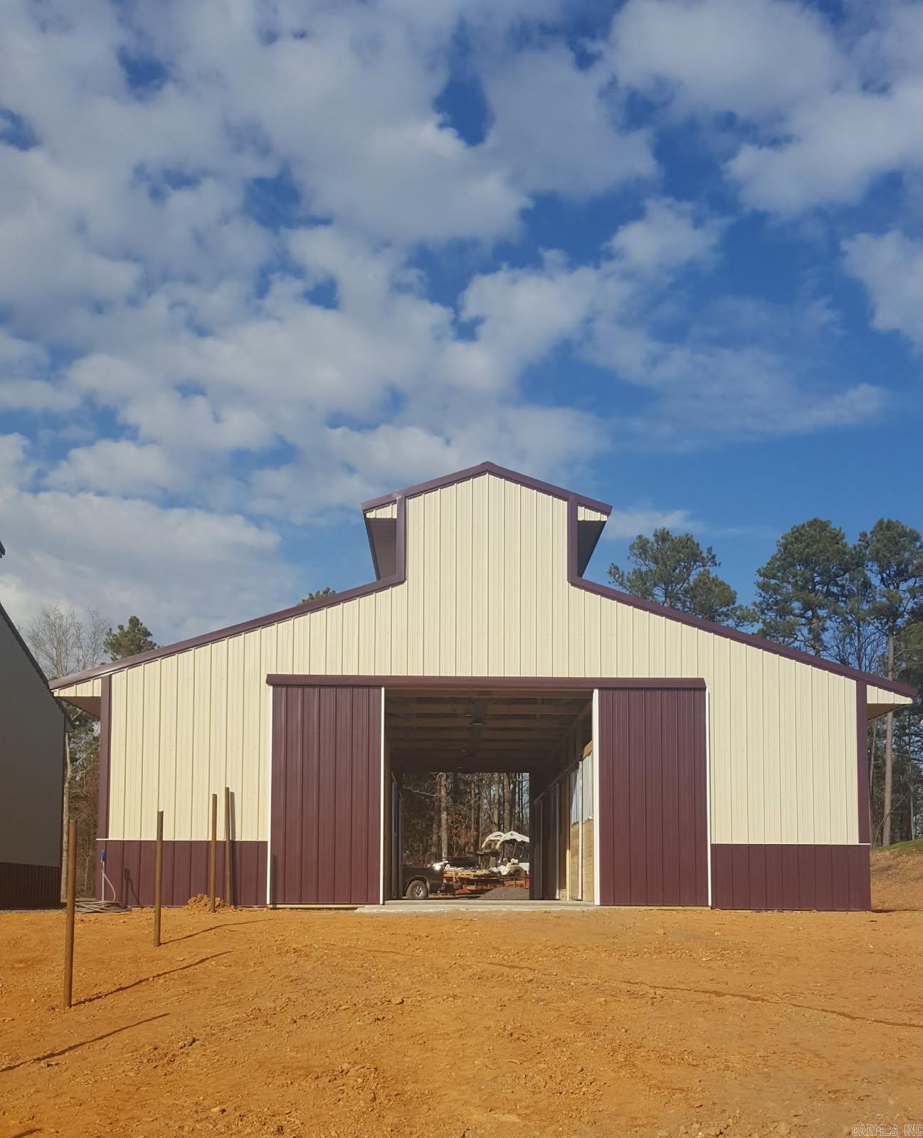 Beautiful, unique farm in yell county! Beautiful views! Pasture land and wooded areas with a creek, spring, steel cable fencing, cross fenced, 40x40 shop, horse barn, equipment shed and more! 2 RV hookups on site. Rural water and 2 wells. Please reach out to listing agent for more details about the property.