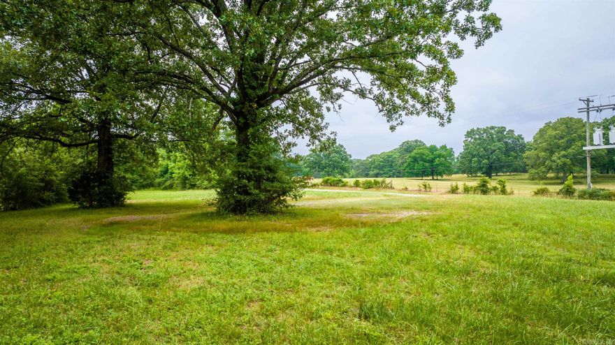 Beautiful setting with abundant pasture and some timber land. 1/4 mile from Lawson Elementary. Very convenient and easy access. Absolutely gorgeous!!