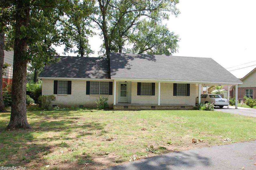 Lots of house for the money. 3 BRs, 2 BAs. Den with a fireplace. Formal living room/dining room combination. Utility room plus an upstairs bonus room that could be a 4th bedroom or game room! Hardwood floors in all but the kitchen and den. Brand new interior paint. Storage building in back and a single car carport with storage/workshop room. New HVAC in 2013 and new roof in 2011! Circular drive for easy access.