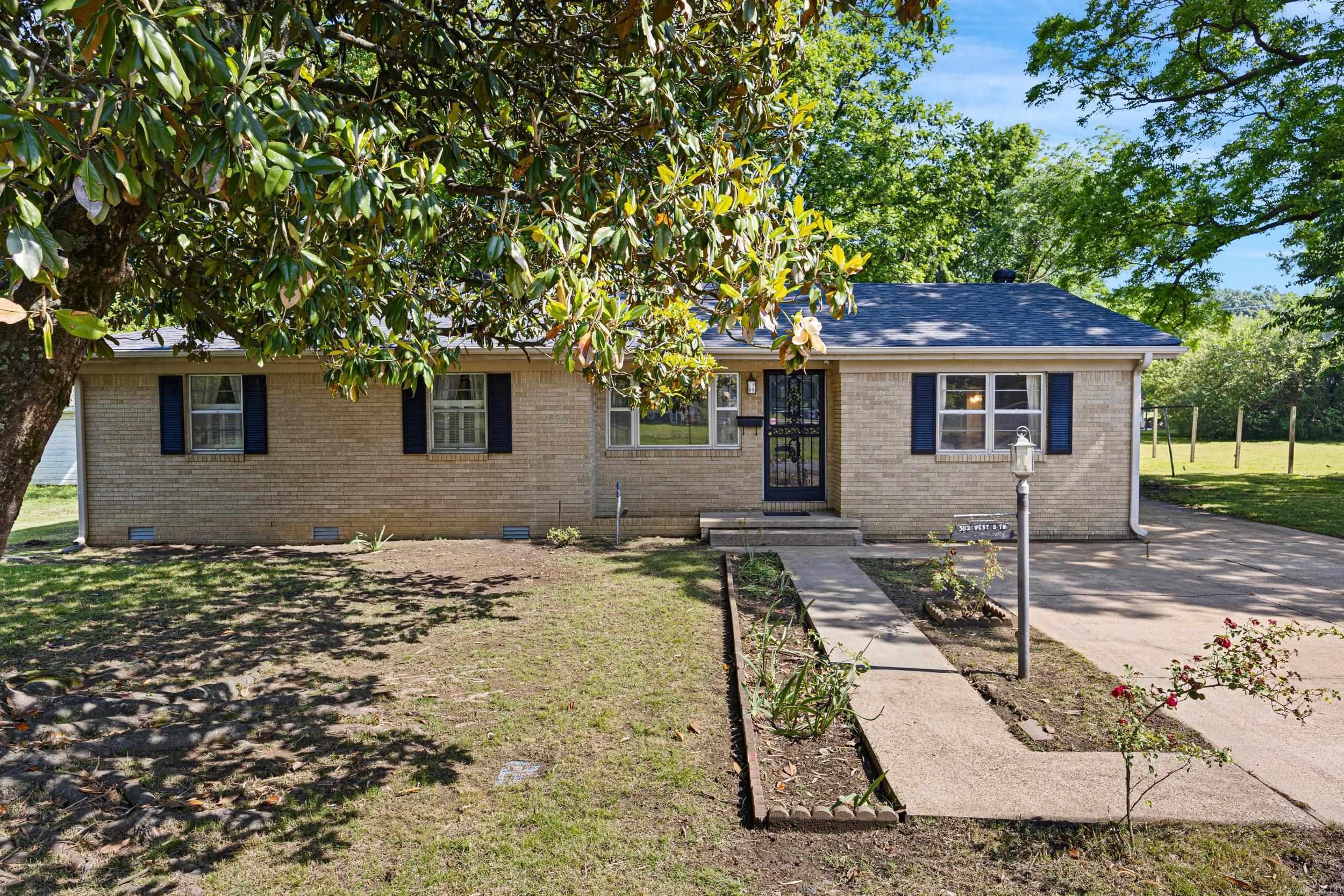 This inviting 3 bedroom, 2.5 bath home offers comfort, versatility, and outdoor living at its best. Nestled just steps from the scenic Russellville community trail system and conveniently close to schools, this property is perfect for families or anyone seeking space and convenience. Inside you'll find a flexible den that can easily serve as a 4th bedroom, home office, or playroom. A newer roof provides peace of mind, while the detached garage includes a dedicated workshop area - ideal for hobbies, storage, or DIY projects. Step outside to a large fenced backyard, perfect for pets, play, and entertaining. The covered patio creates a cozy space for year-round outdoor dining or relaxation.