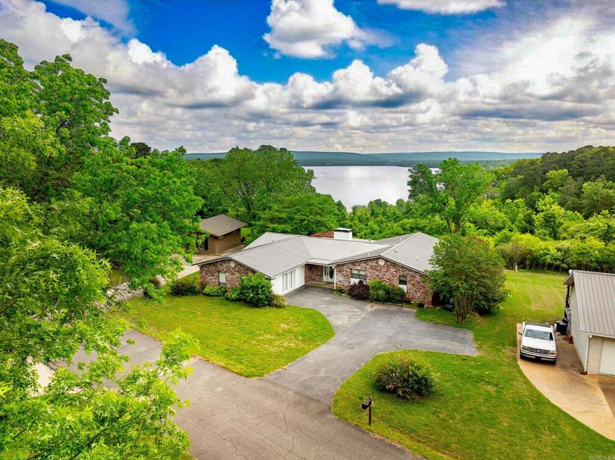 A shore thing- Lakefront Living in the Heart of Heber Springs!   This spacious and well-maintained 4-bedroom retreat offers the ideal combination of peaceful lakefront living and small-town charm — all with a gentle, walkable path right down to the water’s edge.  All four bedrooms are generously sized, with the primary suite offering added privacy and comfort. The outdoor space is ideal for enjoying the seasons — from quiet mornings with coffee by the lake to evenings watching the sunset.   Located just minutes from downtown Heber Springs, residents will enjoy easy access to a variety of amenities including shopping, dining, and recreational attractions. Area highlights include: Sugar Loaf Mountain hiking trail, Sandy Beach and Greers Ferry Lake Marina, Trout fishing on the Little Red River, Local festivals, golf courses, and antique shops.  This is a rare opportunity to own lakefront property in one of Arkansas’s most desirable communities.