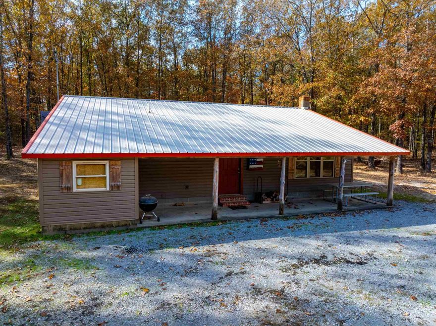 If you're looking for a small, private hunting getaway in the Ozarks, this 21± acre property just off Hwy 115 on Judge Anderson Rd is the perfect fit.Located near Smithville and only minutes from Cave City, this wooded tract offers seclusion while still being less than an hour from Jonesboro.The custom 1,184 sq ft cabin was built by the sellers and features 2 bedrooms, 1 bath, a spacious laundry room, and an open kitchen/living/dining area with nice cabinetry and room for a dining table.The layout is simple, clean, and comfortable, ideal for weekend stays or full-time living. A gated entrance provides added privacy, and a small outbuilding sits beside the cabin for storage.The 21± acres are covered in mature hardwood timber with established food plots and deer stands already in place. This area is known for excellent whitetail and turkey hunting, and the terrain is easy to navigate. Whether you're looking for a hunting retreat, a peaceful escape, or a place to build upon, the land is ready to enjoy.Located in Sharp County near the small community of Smithville, this property sits just outside Cave City and offers quick access to Ash Flat,Batesville, and within 1 hour to Jonesboro.