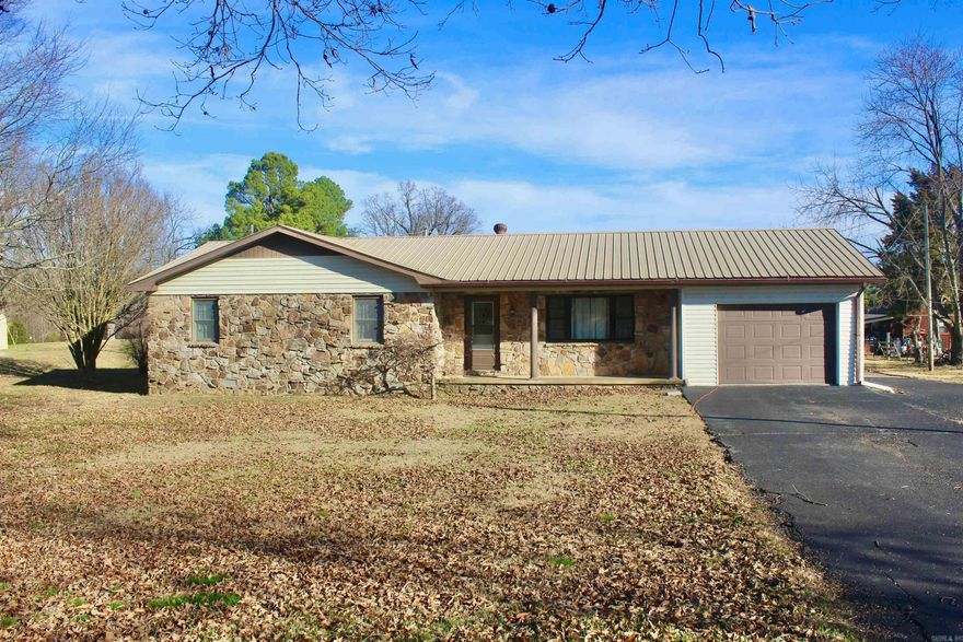 Tucked away on 1 acre in the rolling hills of Pocahontas, this 1,808 sq ft home offers the best of both worlds—just minutes from town, yet far enough out to feel private and peaceful. From the moment you arrive, the covered front porch invites you to slow down and enjoy the quiet. Inside, the home is warm and functional, featuring central heat and air, a laundry room, and an extra room that easily becomes a dining space, home office, or cozy retreat. The metal roof adds durability, while the 1-car garage provides everyday convenience. Out back, a covered deck overlooks the property, perfect for morning coffee or evening sunsets. For those who need space to work or create, two shops—an 8x12 and a large 20x40—offer endless possibilities. This is country living with comfort, space, and the ease of being close to everything Pocahontas has to offer!!