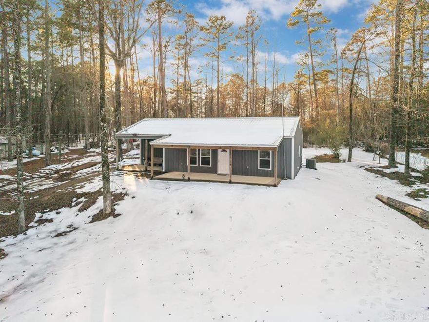 This well-maintained 3-bedroom, 2 bath home features an open concept floor plan with a spacious living area flowing seamlessly into the kitchen, complete with granite countertops and ample prep space, ideal for entertaining. Currently operating as a successful Airbnb, this property offers immediate income potential or an easy transition into a primary residence or weekend retreat. It's prime location near Lake Nimrod makes it especially attractive for outdoor enthusiasts, with fishing, boating and recreation just minutes away. You'll also appreciate the close proximity to Carter Cove Recreation Area, providing convenient access to boat ramps, picnic areas, and lakeside activities. Whether you're looking for a short-term rental investment, vacation home, or full-time residence, this property checks all the boxes with comfort, location and opportunity near Lake Nimrod.