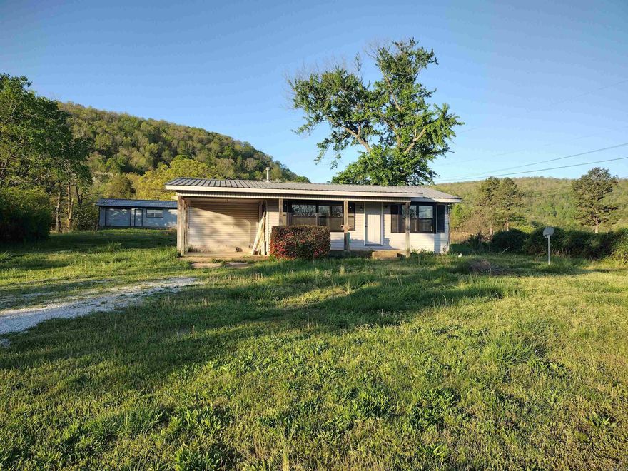 This attractive property, positioned just outside city limits with highway frontage, offers a recently renovated home with new windows and doors, a new gas range, and a new hot water heater, complemented by a large 20x36 shop.