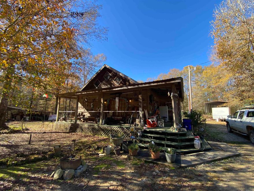 Great opportunity to own your own hunting paradise! Located near Arkansas Natural Heritage Commission land and Felsenthal National Wildlife Refuge this 3.34 acre property offers a 2009 custom-built cypress home with shop, camp house, storage building, metal carport sheds, dog kennel and much more! Main house has vaulted ceiling with exposed beams, pine flooring downstairs and cypress upstairs, galley kitchen (fridge and stove convey). All electric. Central HVAC. Washer/dryer are negotiable.  Unique camp-style property with lots to offer!  (Mobile home w/500 gal septic tank will be remain.)  This listing contains three parcels. Two parcels are owned by one set of heirs, the other parcel owned by the remaining heirs. All three parcels are to be sold together.   Property is located in a flood zone.   Main water well that services all camps is located on subject property. Each camper (3 total) pay a monthly fee for service.  Currently the last camp on the road also shares electrical service with subject property.