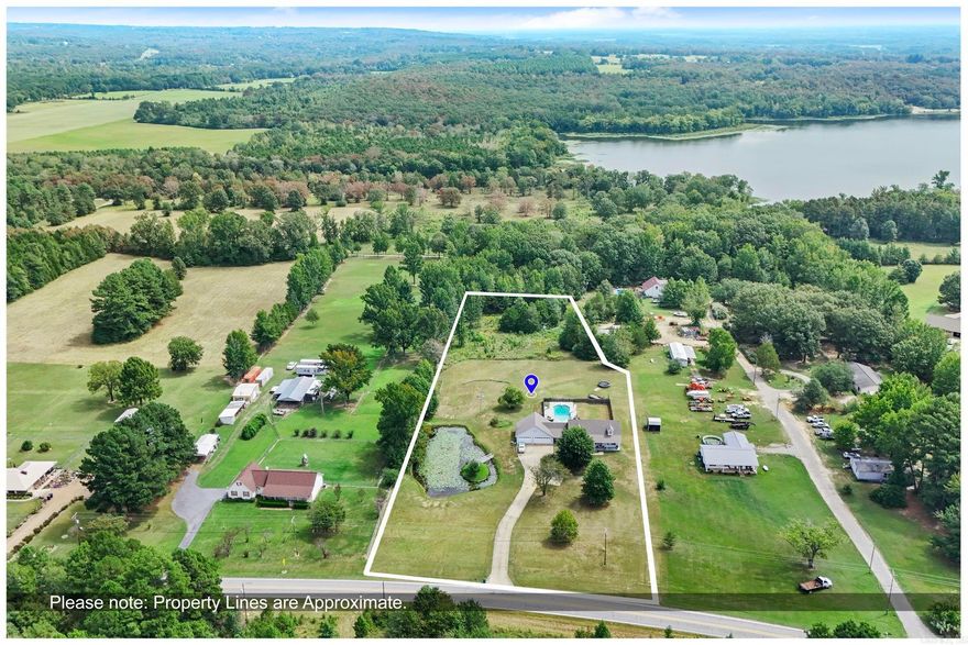 Beautiful 5BR/3.5BA home with 2 living areas or possible in-law quarters, 3 car garage, 3.57 acres, IN-GROUND Pool, & pond. Recently updated: paint, living quarters/apartment above garage,  Hvac units, roof, pool liner and diving board, security/camera system added, kitchen refresh: granite countertops, sink, faucet, appliances, flooring throughout, paint, bathrooms updated, light fixtures/fans & fireplace stone surround.