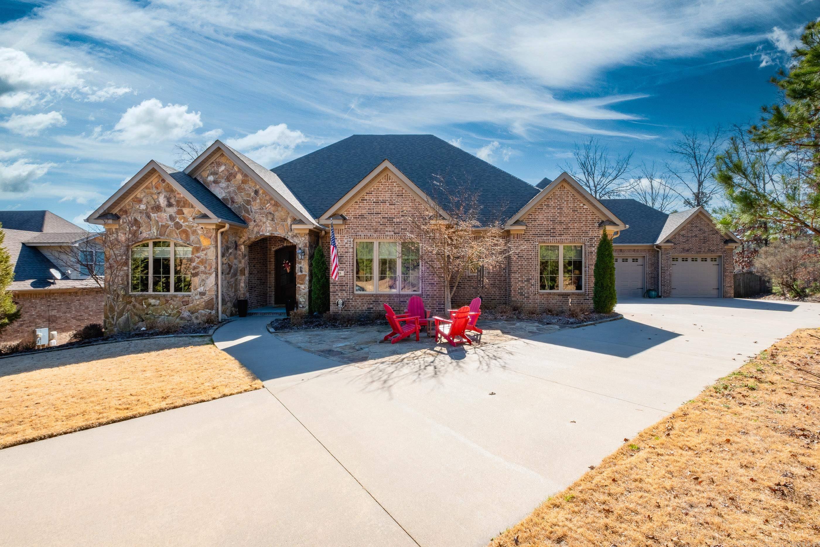 Nestled on a peaceful cul-de-sac, this exceptional one-level home offers panoramic vista views from the front, a spacious lot, and adjoining green space for added privacy. The home boasts a side-loading three-car garage, ensuring convenience and curb appeal. Inside, you'll be greeted by striking finishes and attention to detail. The home features custom millwork throughout, creating a sophisticated yet inviting atmosphere. The open-concept kitchen flows seamlessly into the living space, perfect for both everyday living and entertaining. With four generously-sized bedrooms, each with its own en-suite bathroom, and a dedicated office space, this home provides the perfect balance of comfort and functionality. A versatile bonus room offers additional living space for your needs. Large windows throughout invite natural light, highlighting the home's soaring 12-foot ceilings and elegant 8-foot doors. For added convenience, a large floored attic with a dedicated staircase offers plenty of extra storage. New roller blinds are installed throughout the home, and the garage features a recently finished epoxy floor, adding both style and durability.