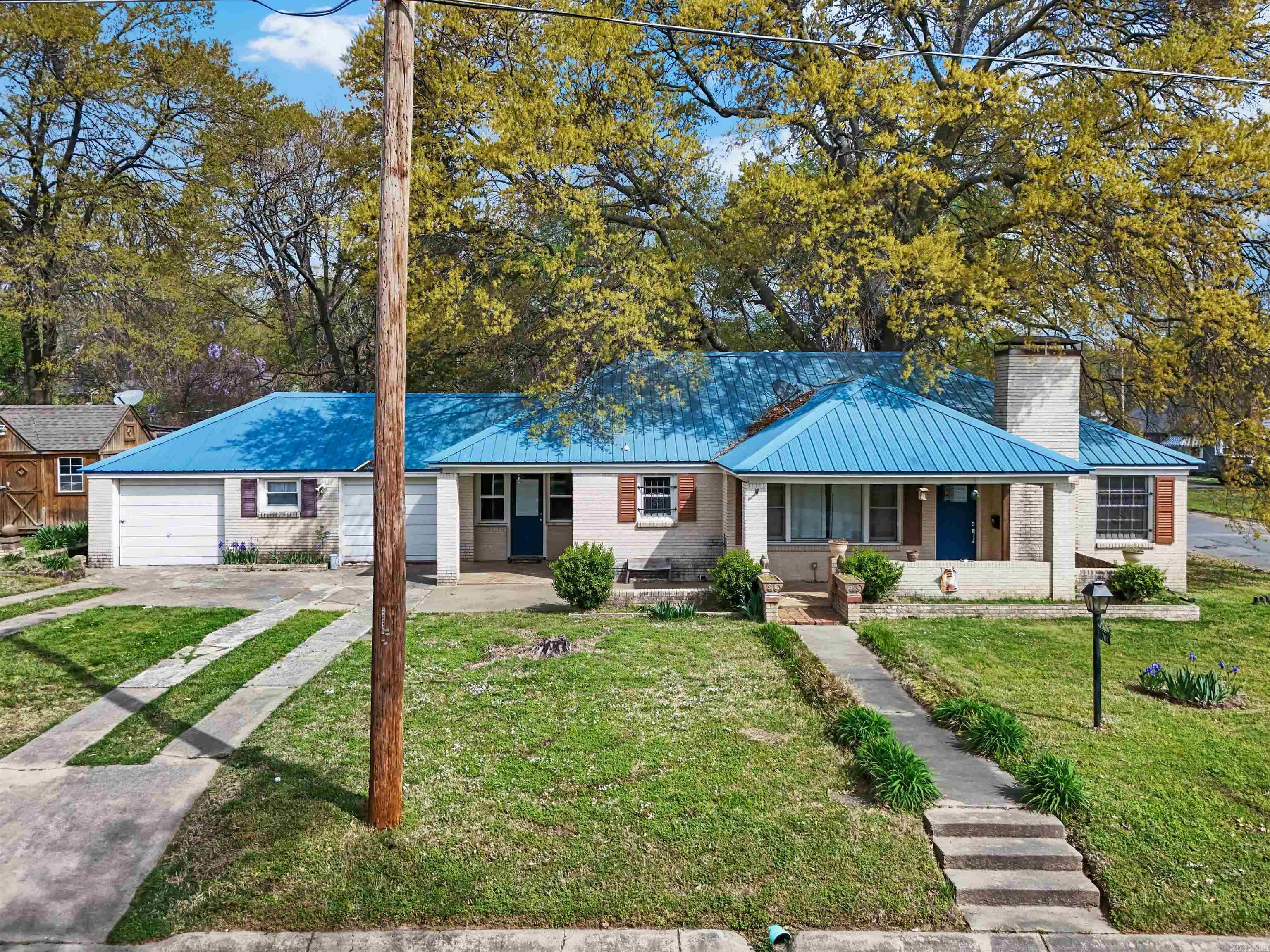 Charming home with original hardwoods, open floor plan, tankless water heater, metal roof, kitchen with custom cabinets and great storage! Home is a quick 5 minute drive to Downtown Little Rock and 10 minute ride to the bike trails. Large storage building with electric too! Be sure to click the video links for the 3D tour and drone footage.