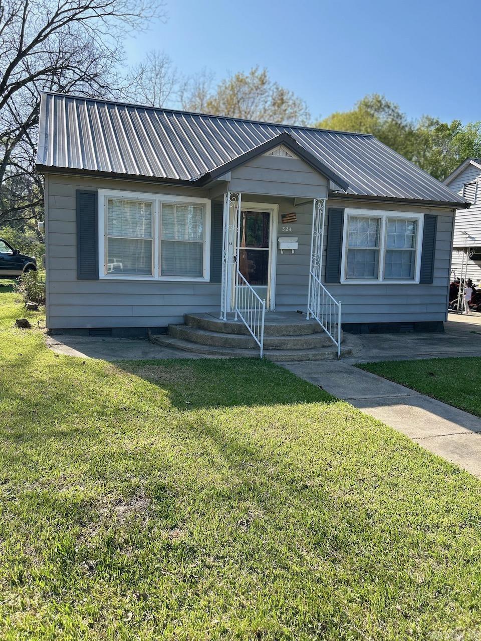 This home has wiring has been updated, repainted interior including ceiling and new ceiling tiles, rNewly carpeted and vinyl throughout, cabinets repainted. Gas range and refrig included in sale. Attitional insulation added/ Move in ready