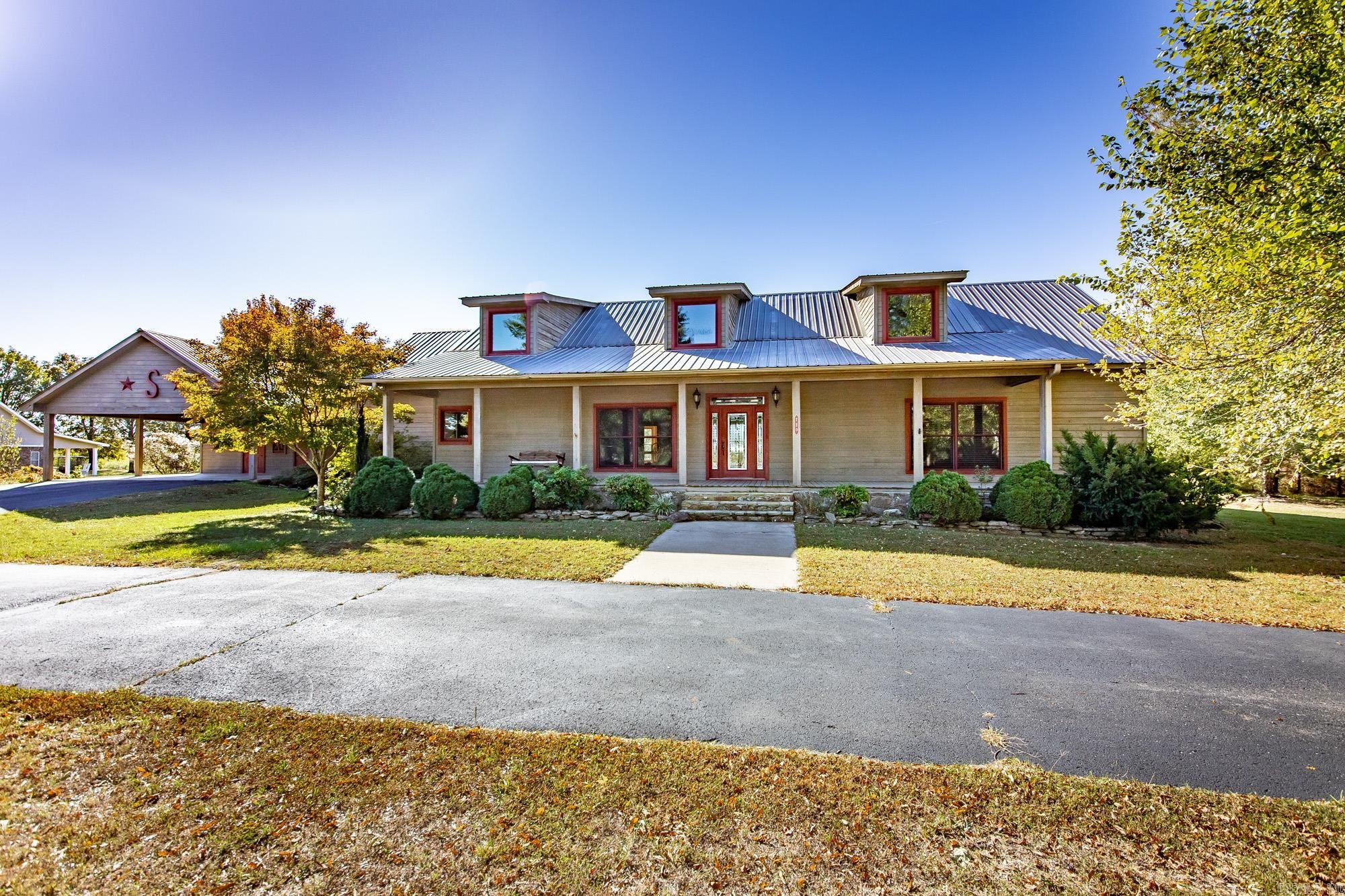 Welcome to this stunning home featuring an open floor plan and vaulted ceilings with a wall of windows overlooking the pool and your backyard oasis! The gourmet kitchen opens to the living area and offers custom cabinets, an island, granite countertop, an extra large pantry and so much more. This custom family home offers supreme craftsmanship with lots of love and attention to detail in every aspect! Located just minutes from Greers Ferry Lake and the Little Red River, this is a must see!