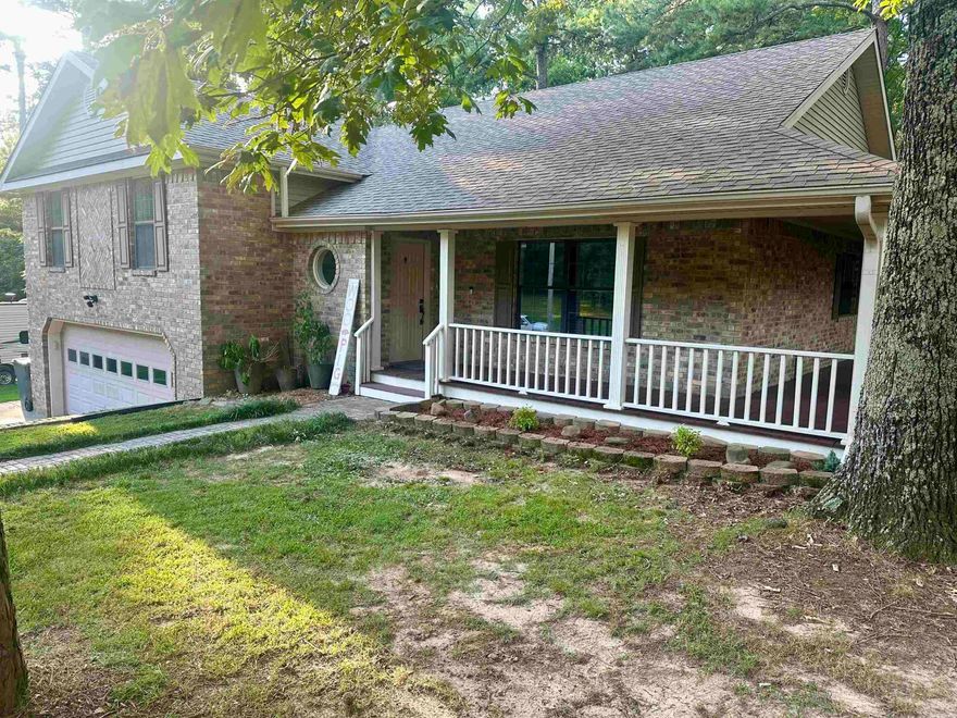 Country setting hosting an all brick tri-level home with wrap-around porch and screened in porch on the back and a brand new HVAC system. 3 bedrooms and 2 bathrooms are located on the upper level. While the kitchen, great room, breakfast bar and dining area are located on the main level. The lower level has 1 bedroom, a 1/2 bath, and the laundry room. From the lower level you will be lead out to the double garage. All of this is sitting on over 1 acre in city limits.