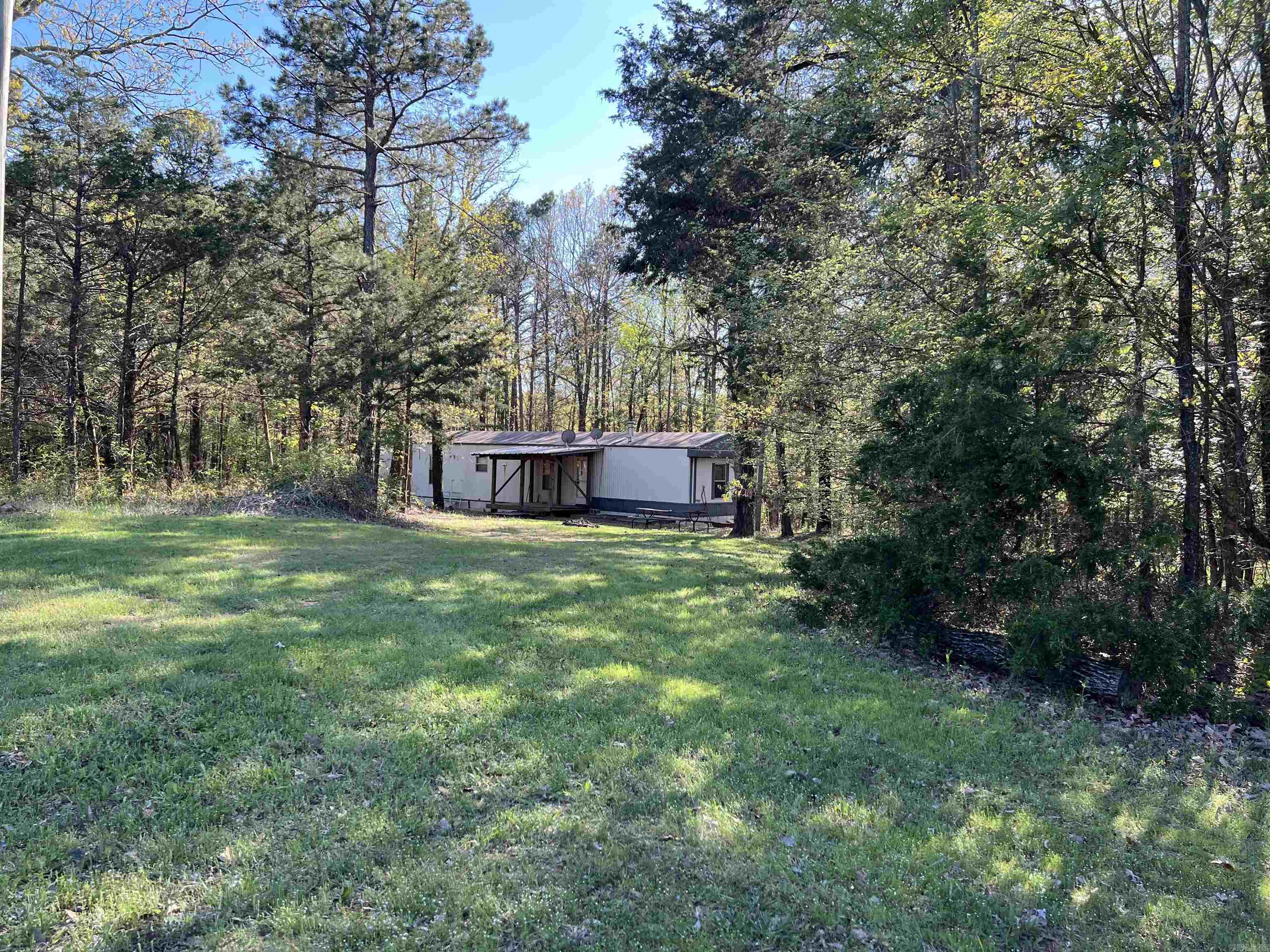 Very Well Kept 1995 Fleetwood 14x70 mobile home with 2 br and 2 full baths. Open living room/kitchen/dining. 1 acre lot, lot has 4 additional spaces for RVs with water and electric connection to each along with in-ground septic barrels. Selling as-is; fridge, stove, washer, dryer, and interior furniture conveys at no addtl cost. Seller paying $2500 of buyer's closing costs (or rate buy down) with accepted offer. Great for owner occupant, short term rental, or lot rental income. Full video tour on youtube, search "860 Fox Chase Dr, Greers Ferry"
