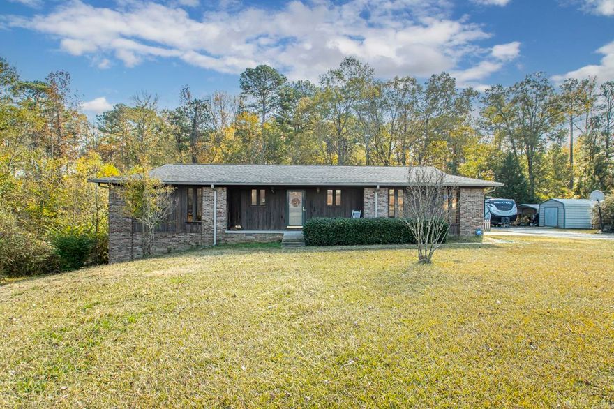 Charming Rustic home sitting on a beautiful piece of property. 3 bedrooms on main level and an a walk out basement that could be used as a bedroom. Basement is finished out. Updated hall bathroom. This home features an open layout of kitchen, dining and living room. Front porch and small covered back porch. Small section of backyard fenced. Carport and small storage building/shop will remain with property. 2 car garage. Roof replaced about 8-10 years ago. HVAC less than 3 years old. HWH less than 3 years old. Please see remarks.