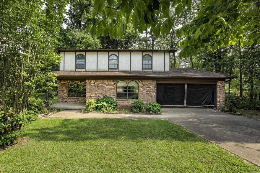 Don't miss this spacious 4- bedroom 2- bath brick and stucco home situated on a corner lot (.76) in the desirable Magnet Cove School District.    This two-story home features two living areas providing plenty of room for entertaining or relaxing.  The kitchen offers a cozy eat-in-space perfect for family meals.    Upstairs, you'll find the primary suite along with two additional bedrooms offering privacy and separation from the main living spaces.    This property offers great potential with solid bones and room to personalize being sold as -is.  With easy access to the interstate and just a short drive to Hot Springs, this home offers incredible potential for this looking to customize their dream space.  Don't miss this opportunity!