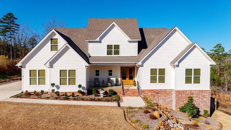 Experience luxury living in this stunning 5-bed, 3.1-bath home in gated Waterview Estates, perfectly positioned on a quiet cul-de-sac with beautiful vista views. The open floor plan is filled with natural light and features a chef’s designer kitchen with natural stone countertops, double ovens, a built-in ice machine, and an exceptional walk-in pantry with custom butcher-block counters and a coffee bar. The main level offers a primary suite and guest bedroom, while every bedroom includes a large walk-in closet. Enjoy the ambience of a modern electric fireplace with color-changing settings. Over $200,000 in seller upgrades enhance the home, including a versatile partially finished walk-out basement ideal as a pool house, man cave, workshop, or extra living space. Step outside to a private oasis with an inground pool and a hot tub that cascades into the water, plus a covered porch and sprinkler system. Additional features include a 2-car side-entry garage, tankless water heater, EV charger, and proximity to Pinnacle Mountain State Park and Two Rivers Park. Too many wonderful features to list.