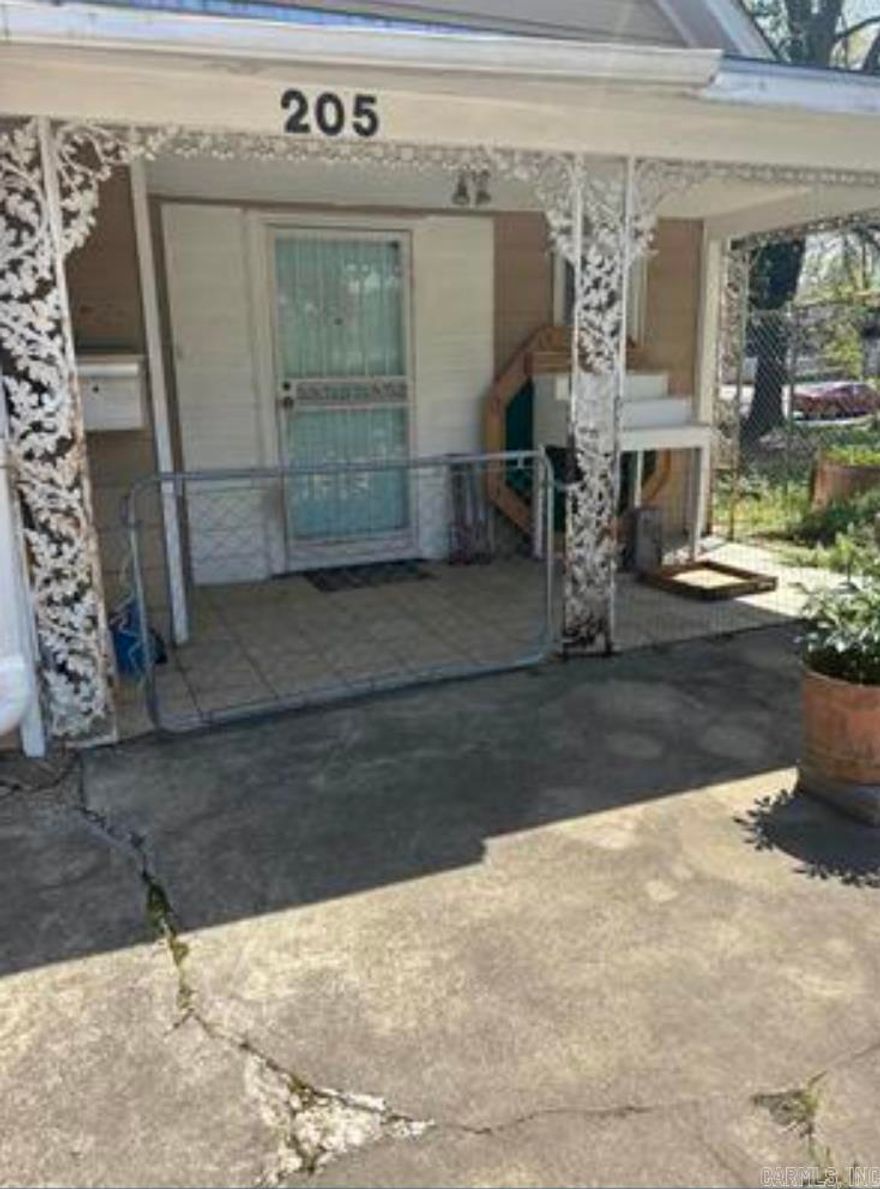 Don't miss this one! a 3/2 house hardwood floors two living areas. The basement opens up to a business space with 37 ft frontage on Central Ave. Perfect for a small business just minutes from Oaklawn! Call today to see!