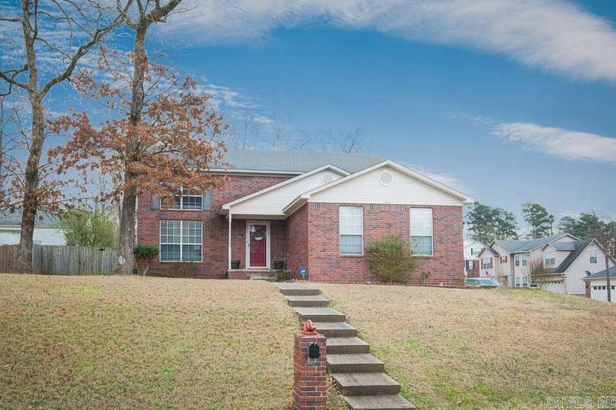 Wonderful 4 bedroom West Little Rock Home. Home features include: master bedroom down with walk in shower, 2 story living area opens to kitchen and dinning areas, large upstairs bedroom with built in desk and cabinets, walk in closets, side loading, 2 car garage, large fully fenced back yard with play set that conveys. Must see to appreciate all this home has to offer.