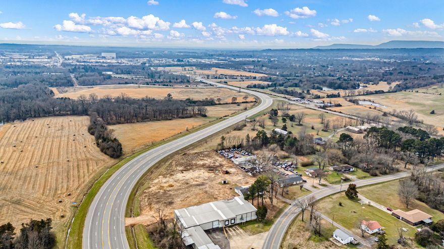 Prime Commercial Opportunity – High-Visibility Zoned C2 Property This 2.85-acre commercial property offers a rare opportunity in a highly visible, easily accessible location. Zoned C2, it supports a wide range of business uses. Positioned along Highway 124 and off of exit 83 Weir Rd with 520 feet of highway frontage, the property provides outstanding exposure. With an ARDot daily traffic count of approximately 12,700 vehicles, your business will benefit from steady visibility and drive-by traffic. Located just ½ mile North of Interstate 40, the site offers convenient access for local and regional customers—ideal for retail, restaurant, or service-based businesses. Septic is on site and city water is available, helping reduce development costs. Additionally, the property includes a Newly Remodeled 4-bedroom, 2,104 Sqft, 2½-bath rental home generating $1,300 per month in income—adding immediate cash flow to this prime commercial investment opportunity.