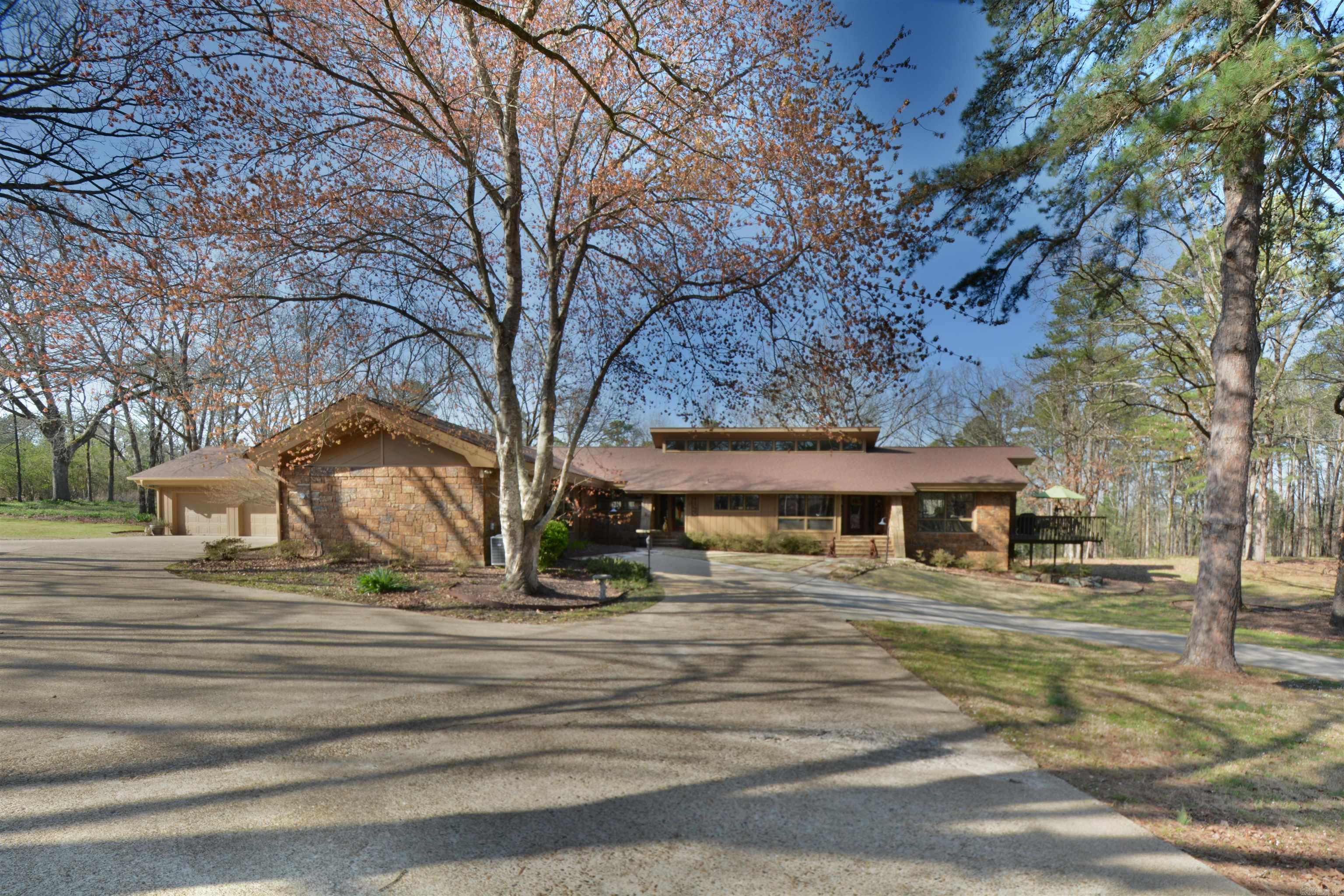 This stunning, custom-built one-level home is an absolute must-see. Two minutes from the prestigious Lakeside Schools, it boasts 4916 sq ft (including the pool house) and sits on 3.4 beautiful park-like acres.Nestled in a small neighborhood that provides privacy but convenience for shopping, this home offers four bedrooms, including two primary suites with adjoining private baths. Adjacent to the primary bedrooms, youāll find an exceptional closet system, a walk-in closet, and a laundry room. At the other end of the home are two bedrooms, each with an ensuite bath. The house has two rock fireplaces, vaulted ceilings, hardwood, flagstone, and tile flooring, and a gourmet kitchen with stainless steel appliances and granite countertops. Pella windows and doors open to a large deck for entertaining and wildlife viewing. There are two large flex rooms, an oversized 3-cargarage, and extra parking pads. An enclosed breezeway with a storage area off the garage leads to a dog run for your pet. An 18 x 36 in-ground pool is the property's centerpiece for hosting poolside gatherings or basking in the sun. This oasis is perfect for relaxation and rejuvenation, with a pool house --->