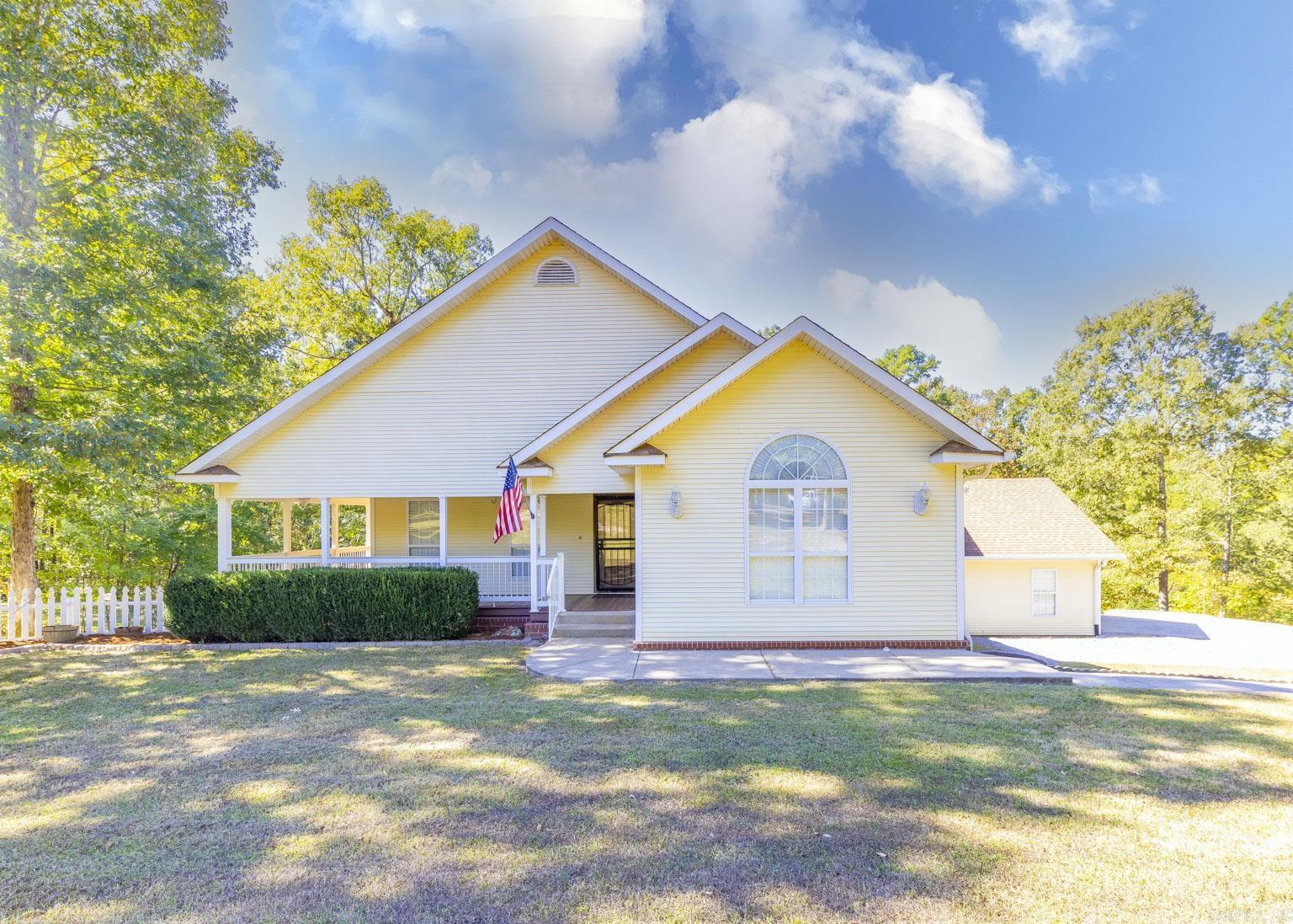 3040 Sparks Rd is the property you've been waiting for! This spacious home sits back from the street on 3 acres, making it private & creating a serene surrounding. As you approach the home, you are greeted w/ a large covered front porch for you to drink your morning coffee. The family room has a nice vaulted ceiling & woodburning FP. There are 3 BRs on the same level, w/ 2 BRs sharing a jack-n-jill bathroom. The dining room off the kitchen has numerous windows allowing lots of light into the home. There is plenty of cabinet space in the kitchen, a breakfast bar & sliding door leading out to the back deck. Master BR has a walk-in closet & master bath has a beautiful walk-in shower and soaking tub. Downstairs is a large open space w/ 2 closets & half bath. This can be used as a playroom, 4th BR, office or rec room. Seller just replaced carpet on stairs with LVP. You can also access the backyard from downstairs. The backyard has a fenced-in play area, making it perfect for children or pets. 2 covered sheds are also in the backyard, with 1 containing an abundance of firewood for this winter. Plenty of land to explore and do whatever you want with.