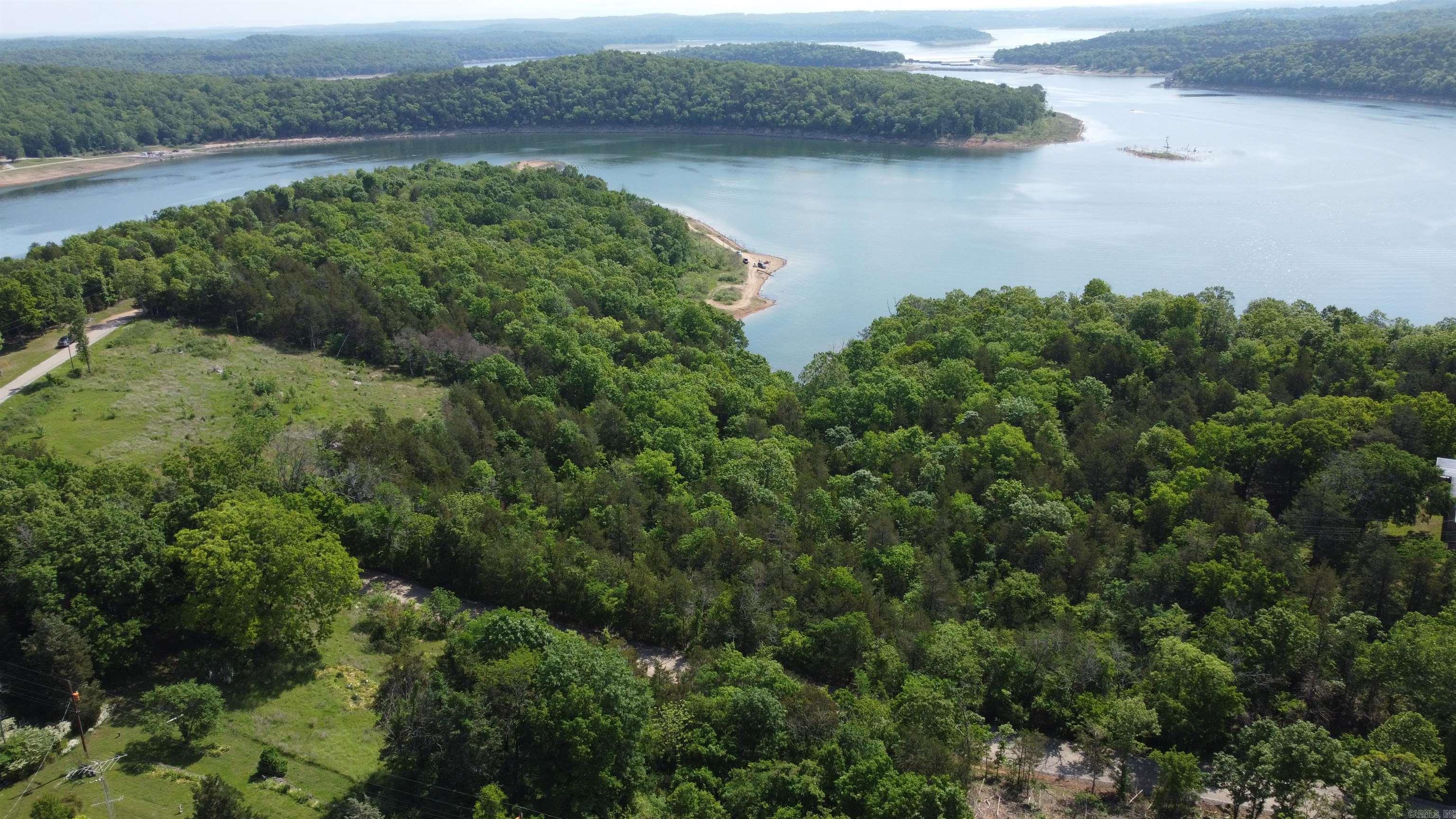 Two lots equaling about 1.39 acres. Year round panoramic views of Lake Norfork. New modern homes being built all around. Close to Pigeon Creek Park. Property borders Army Corps of Engineers on east side. Seller will sell the lots individually for $59,000 each.
