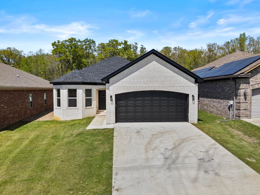 Affordable New Construction in Sherwood. This home is beautifully built with attention to detail. Covered porch in the front and covered patio in the back. All brick for easy maintenance. 9'-10' Ceilings throughout. Granite counter tops. Granite Waterfall Island in the kitchen. Stainless Steel appliances. Crown molding throughout the home. Windows capped and trimmed. Walk-in master closet. Hardwood floors in living room, kitchen, and dining area. All electric for easy maintenance.