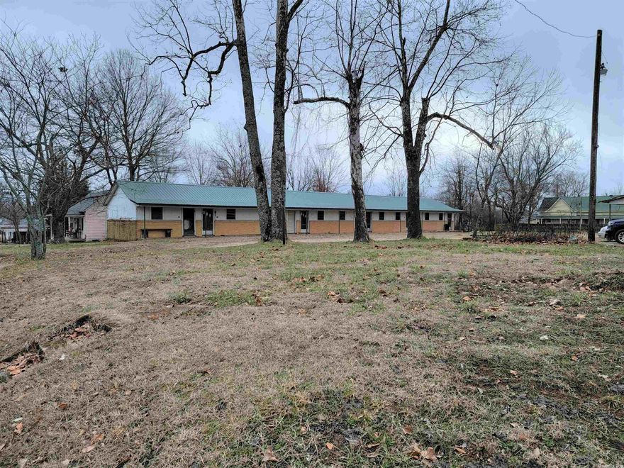 Investment Property Opportunity!!  Breathe Life back into these once beautiful apartments!  There are 13 Units that would make Great Apartments!  There is also an Office with a Private 2 Bedroom Apartment for the Manager!  The Metal Roof is about 5 years old!  Large Storage Building in the Back!