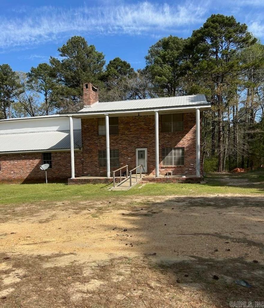 Here is the steal *** 2 story brick home ** newer carpet ** needs a little updating *** huge garage *** 30x100 shop with electricity, 4  sliding doors and 1/2 bath *** perfect for the handyman *** East End Sheridan Schools ** as is **