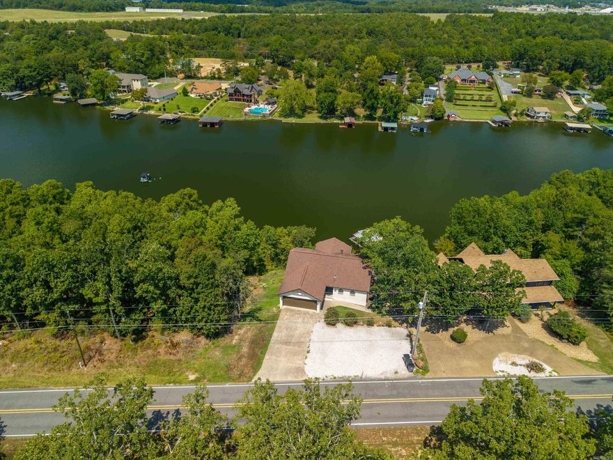 These side by side properties present an exceptional investment opportunity on Lake Hamilton. Both homes are fully furnished, turn key, and STR licensed with transferable permits. With a total 9 bedrooms across two residences, multiple docks, and proven income potential, this package offers flexibility to maximize rental revenue through short term or long term strategies. See also MLS# 25034224 and MLS# 25034301
