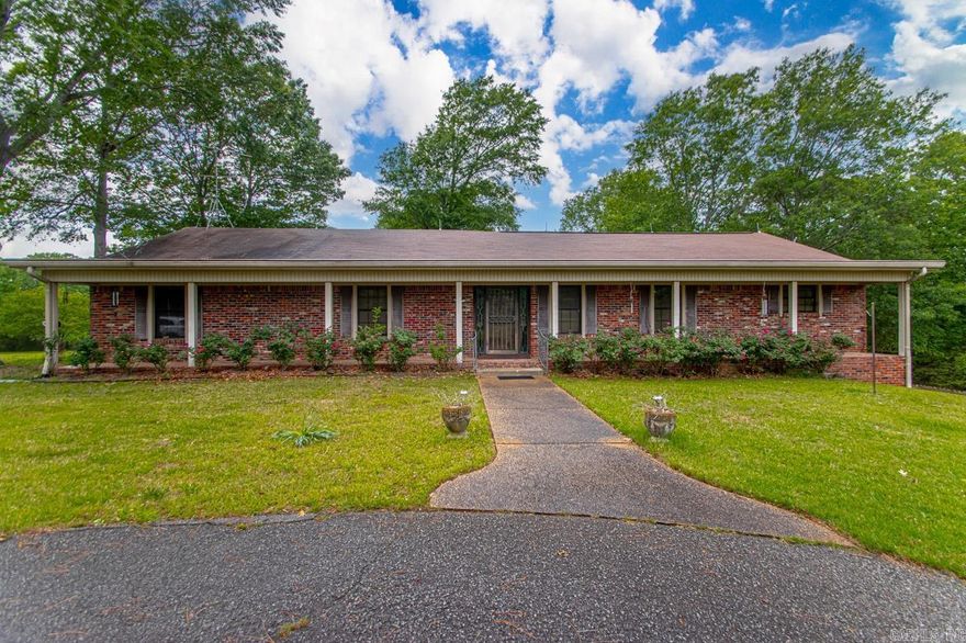 Location makes this a One of a kind property with +/- 14.5 acres that includes a pond, main home, guest house (sq. ft NOT incl), shop with electricity.  Approx 1.25 miles to Walmart on Chenal and close to Pinnacle Mtn.  As you enter the gate, the 1.5 acre pond sits just to your right. The main home needs updating but there is so much POTENTIAL!  It has great bones.  Entering the home, you will find a huge great room with fireplace. It is semi open to the kitchen and a second living space.  All bedrooms and bathrooms are found on this floor.  Downstairs is a private office.  The master bath shower was recently redone.  HVAC unit 2023, outdoor 2016.  Shop with overhead door and elec.  Whole house generator. Possibilty of pickleball courts on area that used to be tennis court.   So much potential!!  AGENTS SEE REMARKS IMPORTANT!!!