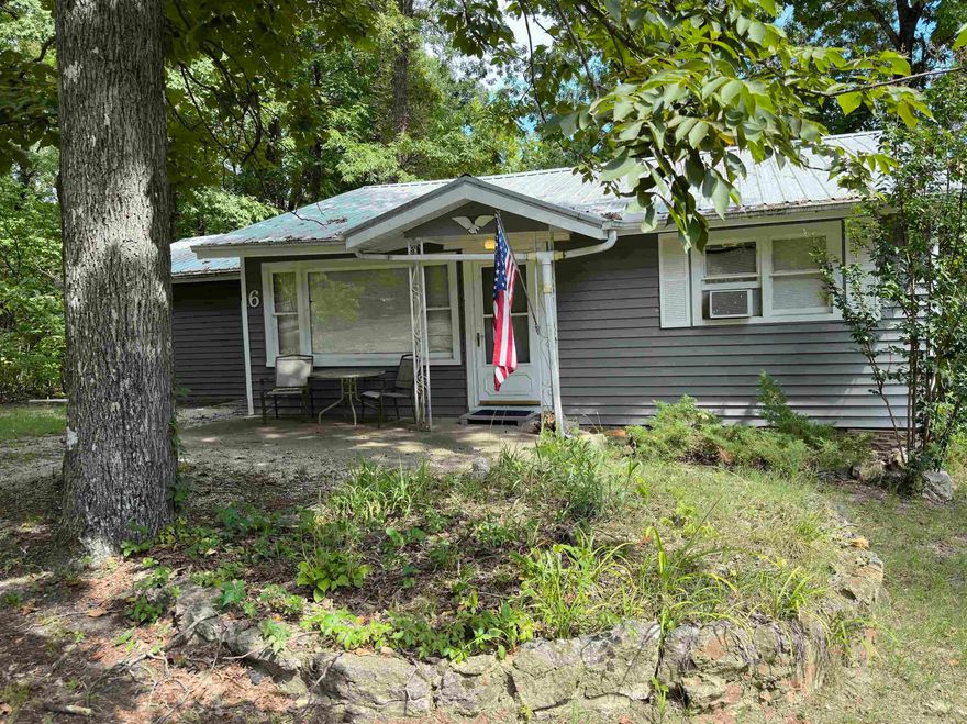 Furnished Cottage home available in the Lake Vagabond area near Spring River and Old Hardy Towne! Tucked into a relaxed wooded subdivision on paved roads this home is priced below appraised value! Enjoy summer fun in the sun at the spring fed lake and get cozy tucked in front of the fireplace on cool fall and winter nights. There is plenty of indoor and outdoor space in this home! In addition to the 2 bedrooms and one bath, there is a bonus room currently used as a 3rd sleeping area and office, there is a workshop and dedicated laundry room, a basement room with hot and cold water for cleaning up outdoor toys and equipment. Priced to SELL  and BOAT CONVEYS :)