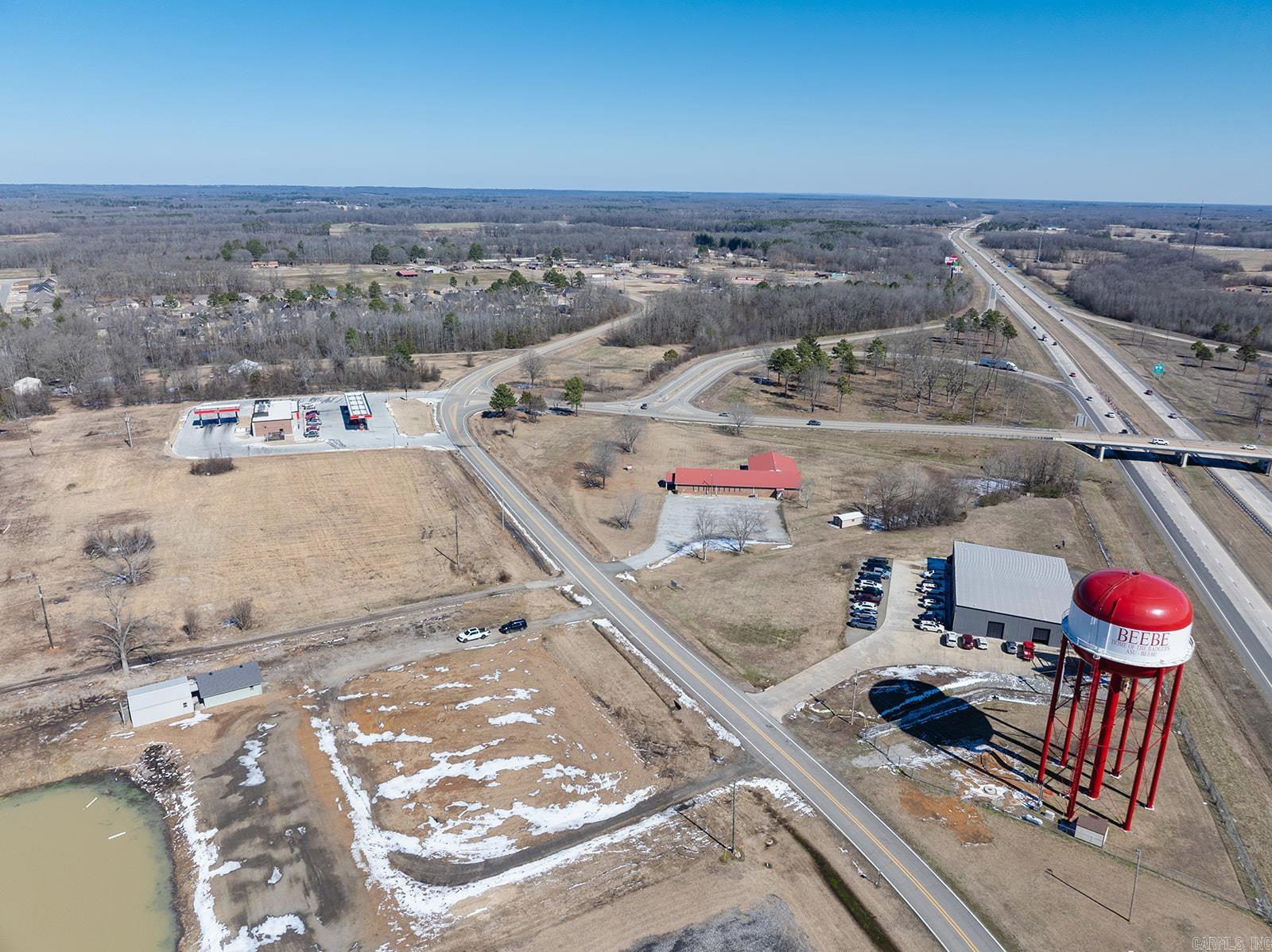 Great opportunity to grab a piece of land currently zoned C-2 that is close to Exit 29 on I-57 and close to even more growth in the future. 1.87 Acres with full visibility of I-57 and fronts Access Rd. A future city road will run down the right side of the property making this a corner lot. That road will lead to the cities proposed sports complex that will be located behind this property. In the beginning this complex will host 5 softball fields. There is a new residential subdivision that has experienced rapid growth the past several years and is within a half mile. The current city ball parks and city recreational/pool area are also less than a half mile away. There is a 9 acre pond just to the rear of the property but there is currently NO access to the pond as it is NOT part of this property. There are 2 small buildings that are in good condition on the property that will convey with the sale. Call the listing agent today for more information.