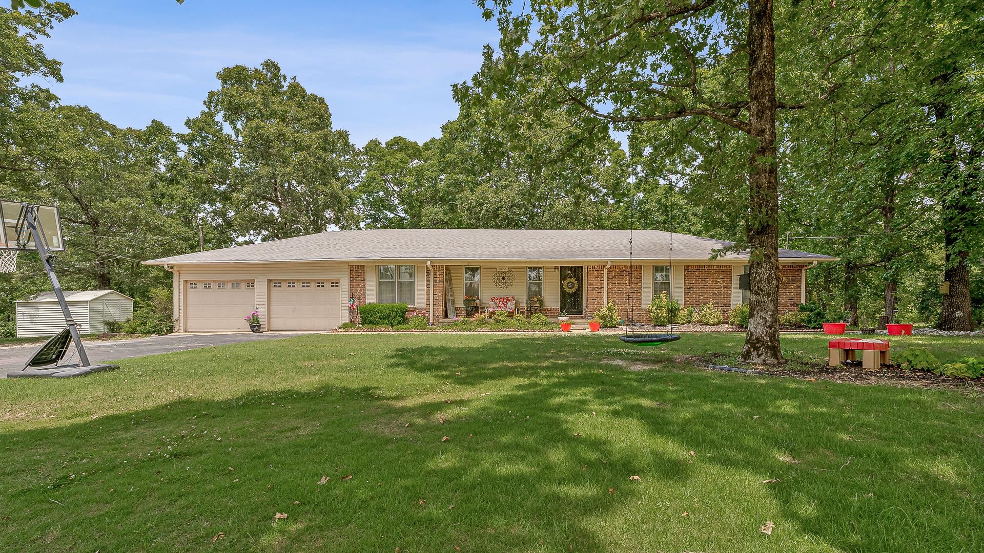 This 3-bedroom, 2-bath ranch offers the perfect blend of comfort and nature. Situated on an one acre lot with close proximity to shopping and hospitals. Inside the home you'll find a welcoming living room, a formal dining area, and a cozy eat-in kitchen ideal for gatherings and everyday living. The spacious laundry room adds extra convenience, and the basement bonus room with exterior access offers flexible space for a home office, guest room, or hobby area. The finished walkout basement has been sealed and guaranteed through Olshan and policy will transfer to new owner. The HVAC is not even a year old!!! Step outside to your private backyard retreat, where a large deck overlooks a serene, one-acre lot filled with mature trees and frequent visits from local wildlife, like deer. Bedrooms are spacious and master has a large closet. The exterior of the property has beautiful landscaping, mature hickory and oak trees, covered wood deck, and outbuildings. Enjoy peaceful mornings and quiet evenings surrounded by nature. If you're looking for a home with space, privacy, and natural beauty, this one is a must-see!