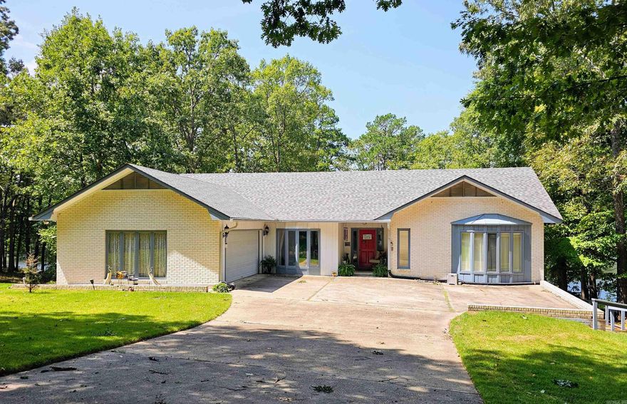 Stay in Shape in this lake view home WITH your own personal indoor resistance lap pool (heated) right off the primary bedroom.  3 Bedroom, 2 bath home with 2 car garage located near all the West End amenities.  Other features include separate laundry; screened in porch; generator; and buried propane tank.   Mostly level lot is common to peaceful Lake Segovia and near walking trails.   Come see all that this home has to offer! See Agent Remarks for additional information.  More photos to follow Estate Sale.