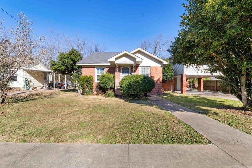 If you crave a true mid-century modern look, this is the house for you.  This beautiful home features original hardwood floors, an oversized vintage stove, original pink tile in the bathroom, glass doorknobs, and a telephone cubby.  All MCM elements. A highlight of this home is the gold flocked wallpaper that is in excellent condition!  Really, it's like stepping back in time but in a great way.