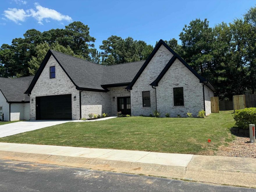 Lovely New Construction, all Brick Home with Bonus Room, 11 foot ceilings in main area, 10 foot ceiling in Primary, 9 foot ceilings in secondary bedrooms, all Shaker Sild Core Doors, Custom Cabinetry, Quartz Countertops in island kitchen with stainless appliances. LVP Flooring. Carpet in bedrooms. Tile in Bathrooms. Gated Community. Large Laundry with built-ins.