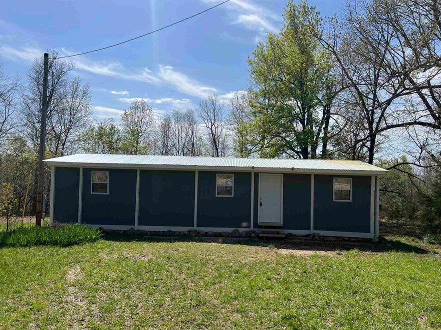 Nestled on 3 beautiful acres at 1170 Many Island Rd, Mammoth Spring, AR, this newly updated 1-bedroom, 1-bath manufactured home with bonus room, offers a peaceful country setting with modern comforts. The home features fresh updates inside and out, providing a cozy and efficient living space perfect for a full-time residence, vacation getaway, or rental investment. A spacious storage shed sits on the property, offering plenty of room for tools, outdoor gear, or hobby space. The land itself provides privacy, with space to enjoy nature, garden, or relax in the tranquility of the Ozarks. Just minutes away, the Spring River is famous for fishing, canoeing, and kayaking, while Mammoth Spring State Park boasts Arkansas' largest natural spring and the historic Mammoth Spring Dam, adding charm and breathtaking views to the area. Whether you're looking for a quiet retreat or an outdoor lover’s paradise, this property is a rare find. No Title to Manufactured Home.