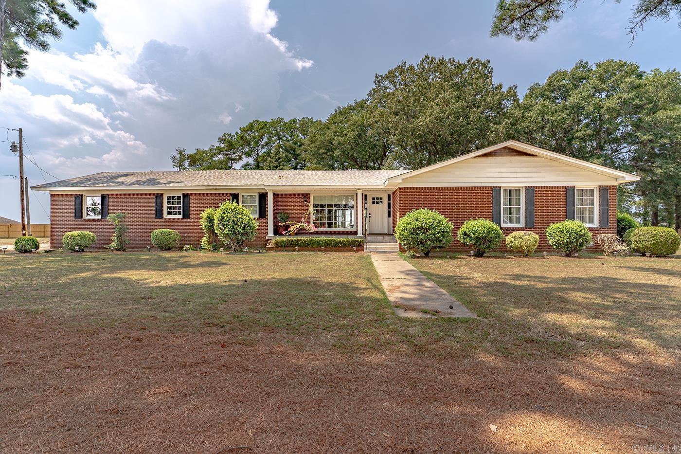 Welcome to Market 809 Hickory Road in Lake City, Arkansas. Located within the Riverside School District and nearby Blytheville or Jonesboro, the residence offers approximately 1,800 square feet of living space situated on 3.30 +/- acres. A tree-lined driveway provides a warm welcome to the home, which features two living areas, generously sized closets, and a back deck perfect for enjoying peaceful sunsets. In addition to the main home, the property includes a garage/shop in the backyard with potential for additional living space above, currently a work in progress. An in-ground storm shelter adds an extra layer of safety and convenience. The home is currently serviced by well water, with city water available if preferred. This type of property does not come along often, call today to schedule your tour!