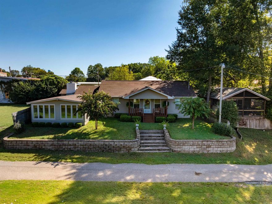 Riverside charm meets outdoor lifestyle.  Step through the front door and into a living space suffused with natural light, where the river becomes your daily backdrop. This 2-bed, 2-bath home commands attention with scenic frontage to the river, mature trees, and a sense that you’re part of the landscape. Both bedrooms are well-sized, and each full bath delivers comfort and utility.  But one of the home’s true treasures is its detached sunroom — a bright, serene space just a few steps from the main house, perfect for a bunk house to sleep all those duck hunters.  Outside, the porch invites long mornings with coffee or quiet evenings with a glass of something cold, watching the sunset’s hues dance across the river.   For the outdoor enthusiast, this is more than a house — it’s a launching pad with a boat ramp on the White River just down the road. The conservation treasure that is Cache River National Wildlife Refuge lies only 16 miles south, offering tens of thousands of acres of bottomland forest, swamp, sloughs, wetlands, and wildlife habitat. During winter and migration seasons, the refuge is one of the region’s most important staging grounds for ducks and waterfowl.