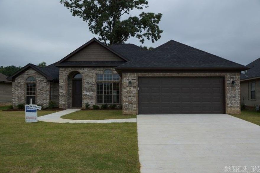 Gorgeous home with wide open family plan.  Huge bar in kitchen, wood floors in living area.  Tile in wet areas.  Ready now!