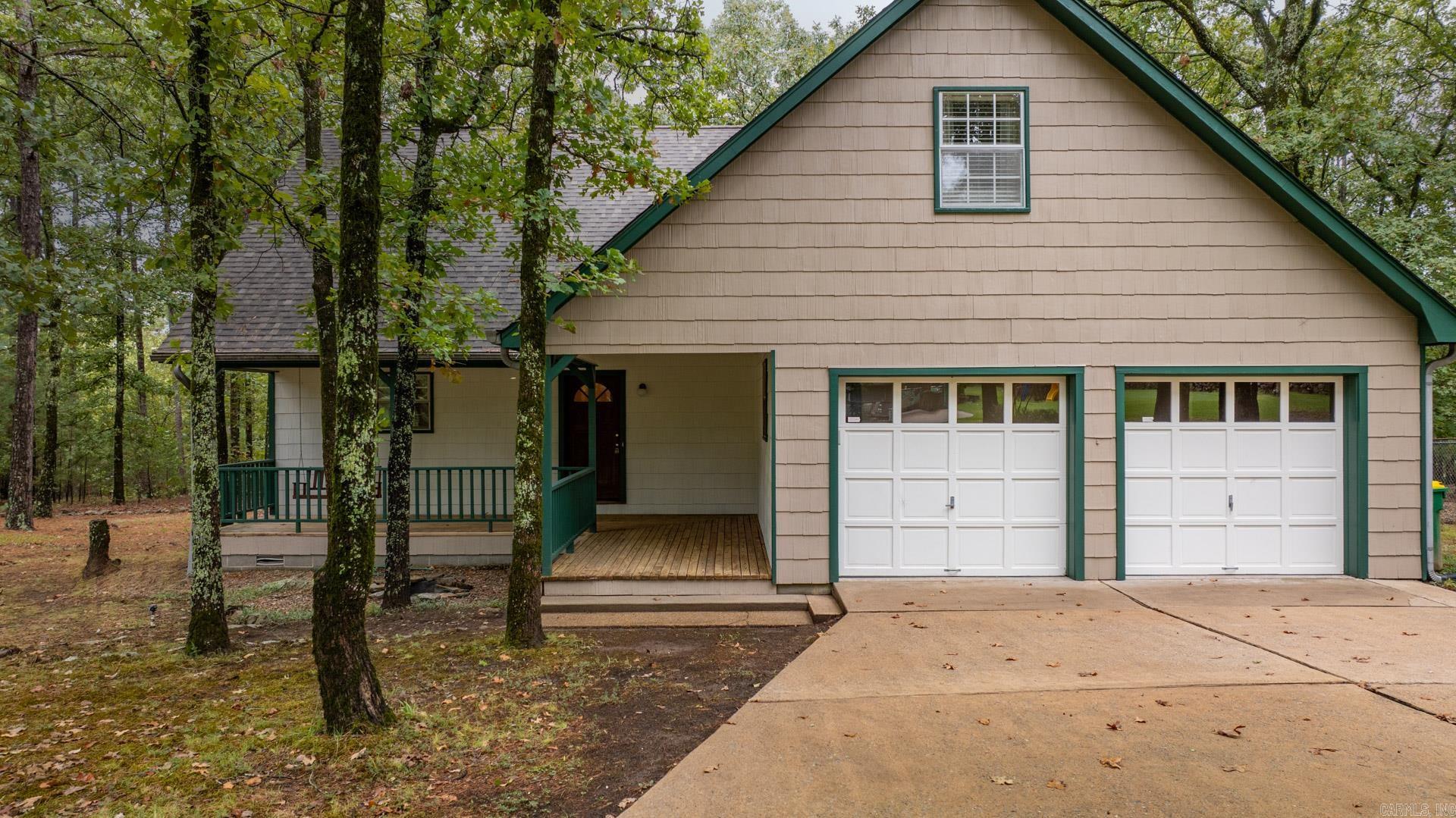 This private home in the woods is move in ready! Great room is grand with 20' ceilings and opens to the kitchen & dining room. Kitchen features include new quartz countertops, subway tile backsplash, and stainless steel appliances. Other features include LVP flooring and new carpet in the bedrooms, updated bathrooms, and closets everywhere. New Roof July 2024. See agent remarks!