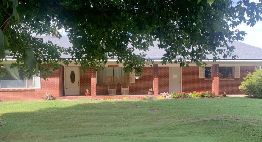 Welcome to a versatile 4.88-acre property, complete with a solid brick home and ample room for expansion! This 3-bedroom, 2-bath home spans 2,082 sqft., featuring a spacious family living room and three-car garage with new doors, along with a detached shop for hobbies, storage, or even a creative project. The shop includes partial plumbing and electrical, offering a foundation for potential customization beyond just storage. The home has its own dedicated septic, installed in 2018.  The secluded back portion of the property is equipped with electric/water/septic connections, making it ideal for setting up a mobile home, cabin, or RV for rental or extended family visits.   Between the shop and back section is 2 large covers for RV's, Tractors etc.  This flat and highly usable acreage is perfect for gardening, outdoor projects, or even adding another structure. Conveniently located close to Mountain View’s beloved local attractions, you’ll enjoy easy access to the White River, restaurants, and the vibrant town square, blending a peaceful retreat with everything you need nearby.