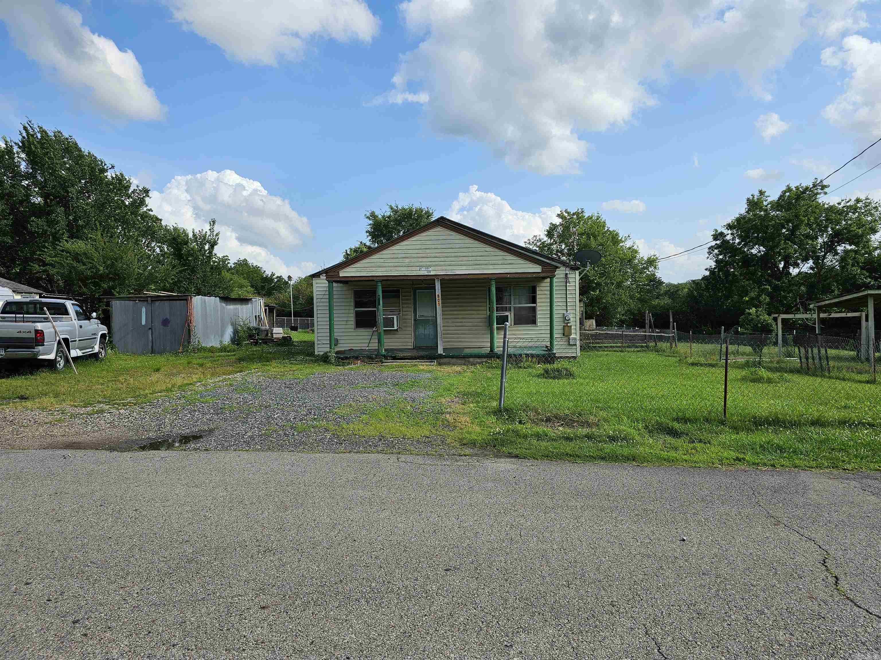 Located in Mena, AR, is this 3 bedroom 1 bath home (1080 sq feet) on .27 acres. Fenced with 2 storage buildings. Natural gas: stove, space heaters and water heater. Nice sized bedrooms and kitchen, walk in closet. Needs a little TLC but has the potential to be a great home.