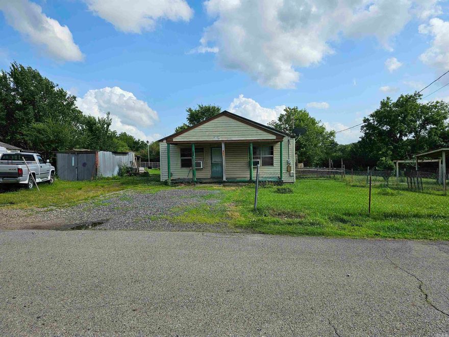 Located in Mena, AR, is this 3 bedroom 1 bath home (1080 sq feet) on .27 acres.  Fenced with 2 storage buildings. Natural gas: stove, space heaters and water heater.  Nice sized bedrooms and kitchen, walk in closet.  Needs a little TLC but has the potential to be a great home.