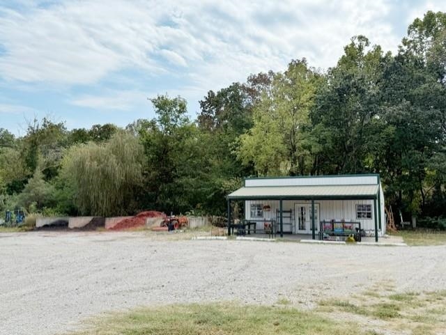 Prime Commercial Property for Sale – 2.8 Acres on US Highway in Pocahontas, AR Don’t miss this fantastic business opportunity on 2.8 acres of commercial property located on a high-traffic US highway frontage at the edge of Pocahontas, Arkansas. Formerly operated as a plant nursery, this versatile property is ready for your vision—whether you’re looking to restart a nursery, develop an RV park, or build mini storage units. The property includes: 600 sq. ft. metal business building Three greenhouses (two with propane gas heat, all with fans and water spigots) Concrete mulch dividers Tractor for maintaining the property Chain-link fenced perimeter for added security Creek along the back of the property With excellent highway visibility and room for expansion, this site is ideal for entrepreneurs, investors, or developers seeking a profitable location in Randolph County, AR. Whether you’re interested in starting a garden center, landscaping business, storage facility, or RV park in Arkansas, this property offers incredible potential in a growing area.