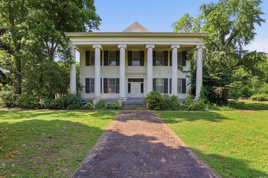 Steeped in nearly two centuries of Arkansas history, 411 East Seventh Street presents a rare and extraordinary opportunity to own one of Little Rock's most iconic landmarks. The Pike-Fletcher-Terry House is a magnificent two-story Greek Revival mansion with Colonial Revival interior design, originally built in 1840 and anchored by a dramatic six-column Ionic portico set against elegantly landscaped grounds. Situated on 1.85 acres across 12 city lots in the heart of the MacArthur Park Historic District, this 6,514-square-foot estate offers soaring 14-foot ceilings, a grand skylight, front and rear staircases, three glass-enclosed rooms, and a separate carriage house with garage — all within walking distance of downtown Little Rock dining and attractions. The property is elevator-ready and ideally suited for a boutique hotel, signature event venue, or luxury private estate, with Federal and State Historic Tax Credits available to qualified buyers pursuing rehabilitation. Offered at $995,000, this is a once-in-a-generation chance to breathe new life into a true piece of Arkansas heritage.