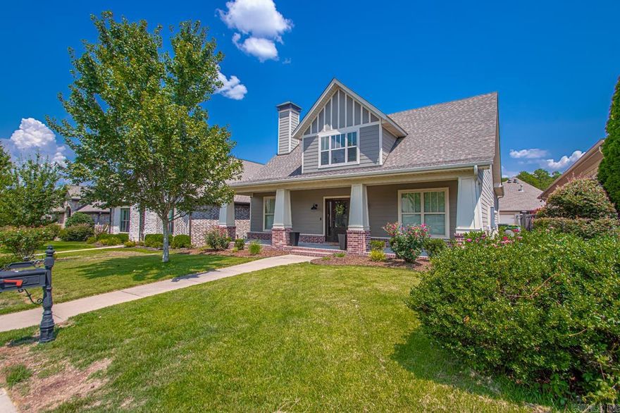 Welcome to this beautifully maintained home in the desirable Wildwood Place community. Built in 2015, this two-level Craftsman blends timeless charm with modern convenience. The open plan features a spacious family room with a cozy gas-log fireplace, hardwood floors, and abundant natural light. The gourmet kitchen offers granite counters, stainless steel appliances, gas range, pantry, and dining area for gatherings.  The main-level primary suite includes a walk-in shower, double vanities, and generous walk-in closet, with two additional bedrooms nearby. Energy-efficient upgrades include Low-E windows, extra insulation, and a tankless water heater.  Enjoy outdoor living with a covered patio, fully fenced yard, lawn sprinkler, and inviting front porch. Community amenities include a pool, playground, and walkable streets. Rear-entry two-car garage with automatic opener adds convenience and curb appeal.  Located off Denny Road in Chenal, this home is close to shopping, dining, and schools. Move-in ready and designed for comfort and style—don’t miss this one!