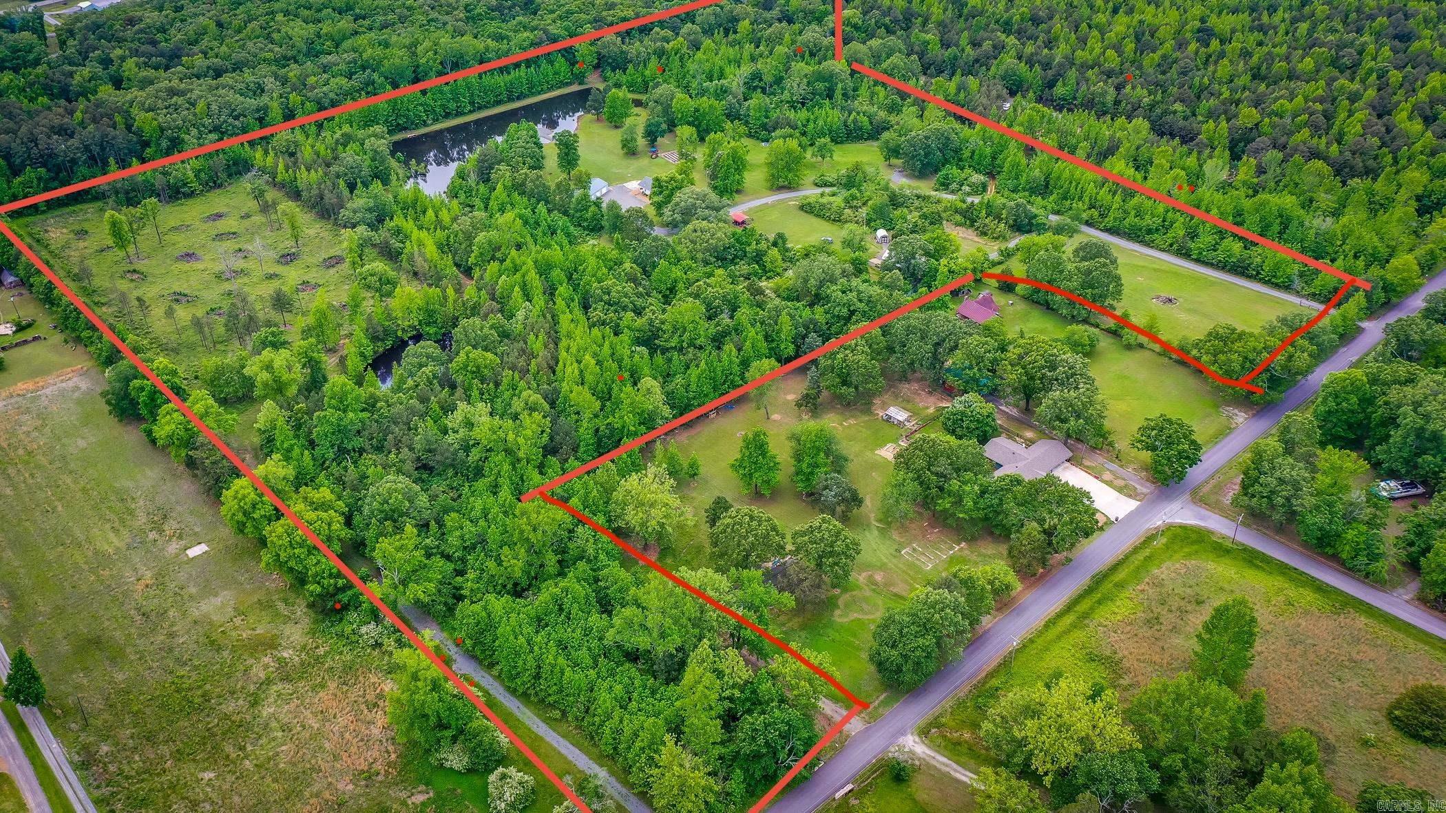 **ONE OF A KIND** 30.97 +/- acres located in the "Heart of Greers Ferry" with less than a mile to public lake access at the end of Stark Rd. (see map in pic, not a boat ramp but great shoreline for swimming & fishing). This property has so many opportunities & has been used in the past for Yoga retreats, Airbnb/Short term rental, Wedding Venue, etc. (Option for an additional $35,000 to make a package deal to include a Bobcat 331 Excavator, Mahindra 2538 Tractor, & Ex-Mark Riding Mower.).The land includes a 2 Bedroom/2 Bath home built in 2019, 30x50 shop heated & cooled w/plumbing stubbed out,2 Ponds (I call one the "Crown Royal" pond),a 16x20 Carport, a newer Storage Building, storm cellar, & a historic barn from the 1800's that was dilapidated & completely rebuilt by the Sellers to make into the cutest Barn with Living Quarters, plumbing, new electrical, its own Septic System, city water, & most of the furniture items will stay along with some table & chairs that were once used during different events held on the property (Refurbished Barn is being sold as-is but has so much character & is fully functional)